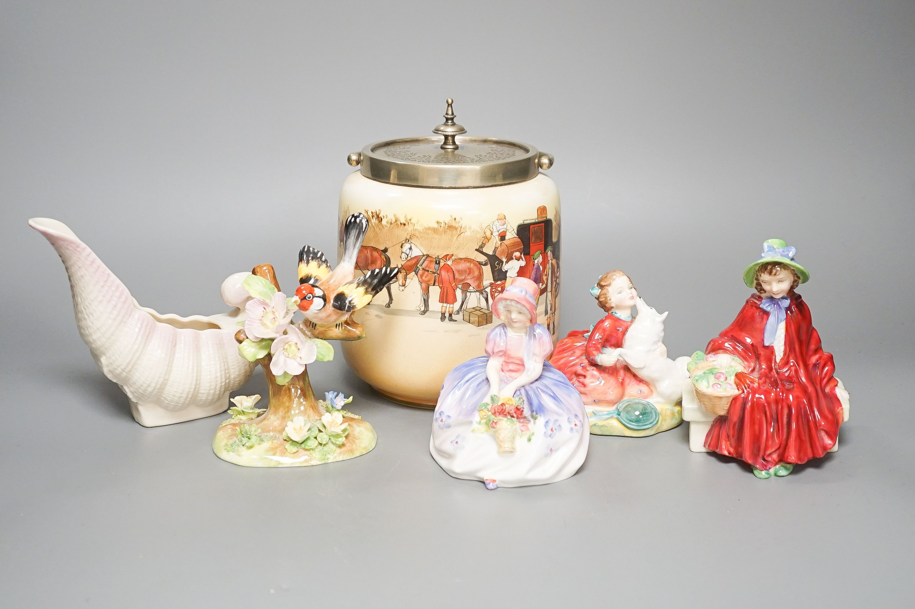 A series ware Doulton biscuit barrel , three Doulton figures, Monica HN1967, Home Again HN2167, LindaCorp 1952, a Crown Staffordshire bird and a Belleek vase.